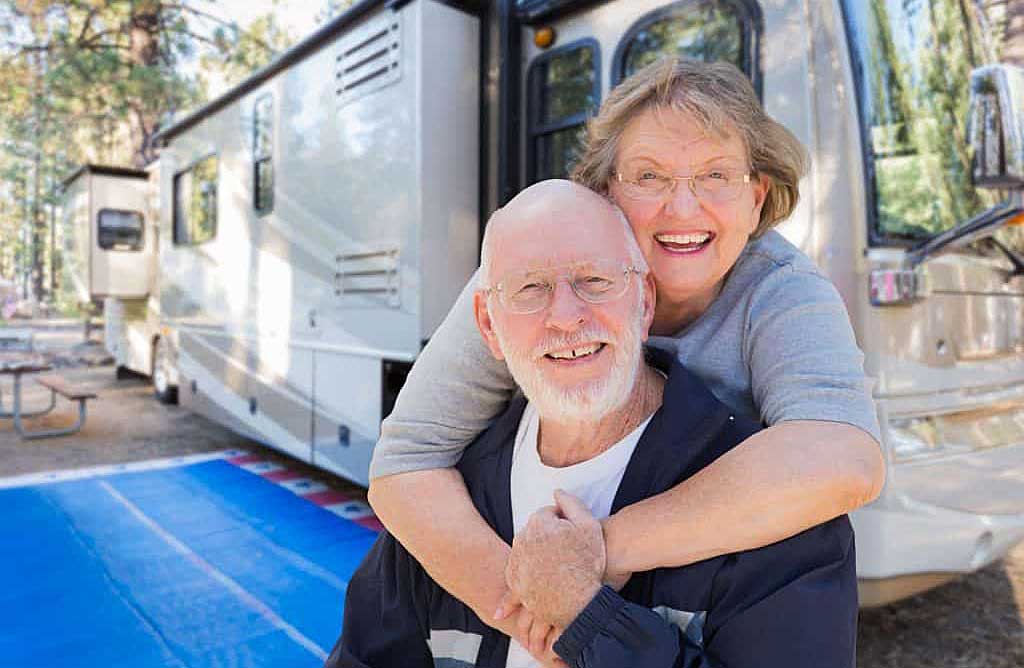 couple in front of rv